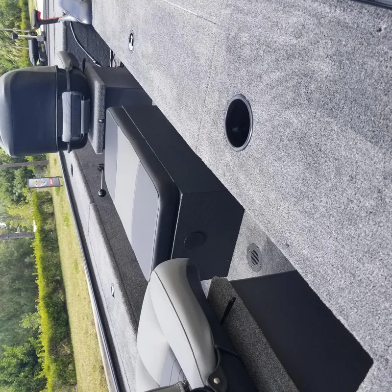 Slide: The Image of 2025 Tracker Panfish 17 boat interior with seating and carpeted deck. - 5