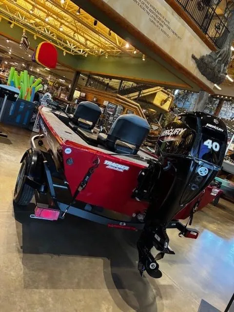 Slide: The Image of 2025 Tracker Panfish 17 boat with Mercury 40 engine displayed indoors. - 3