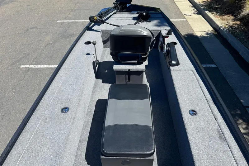 Slide: The Image of 2025 Tracker Panfish 17 boat interior with seating and fishing equipment. - 18