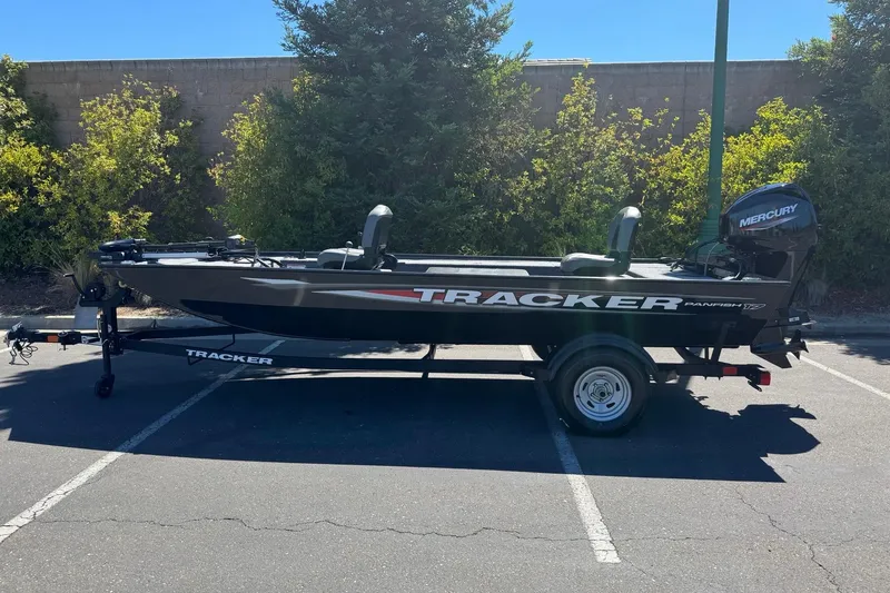 The Image of 2025 Tracker Panfish 17 boat with Mercury engine in a parking lot. - 0