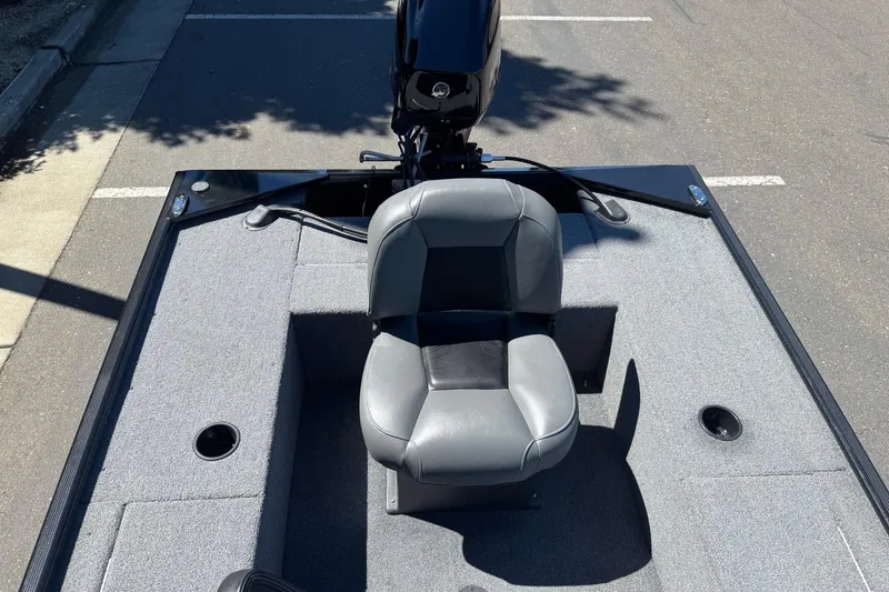 Slide: The Image of 2025 Tracker Panfish 17 boat interior with gray seating and carpeted deck. - 12
