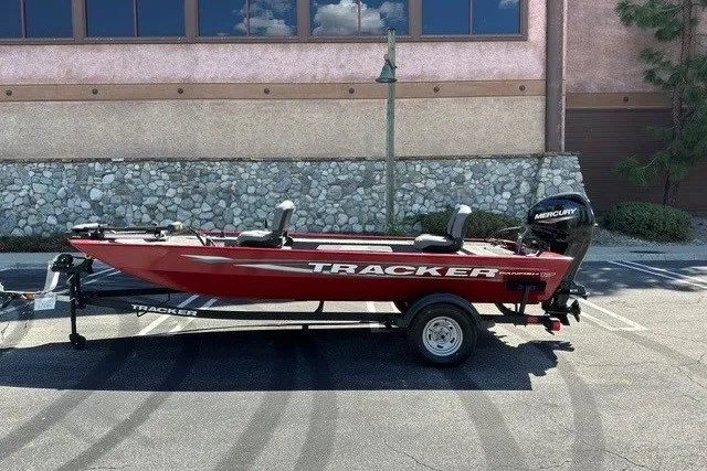 The Image of 2025 Tracker Panfish 17 boat with Mercury engine, parked outdoors on a trailer. - 0