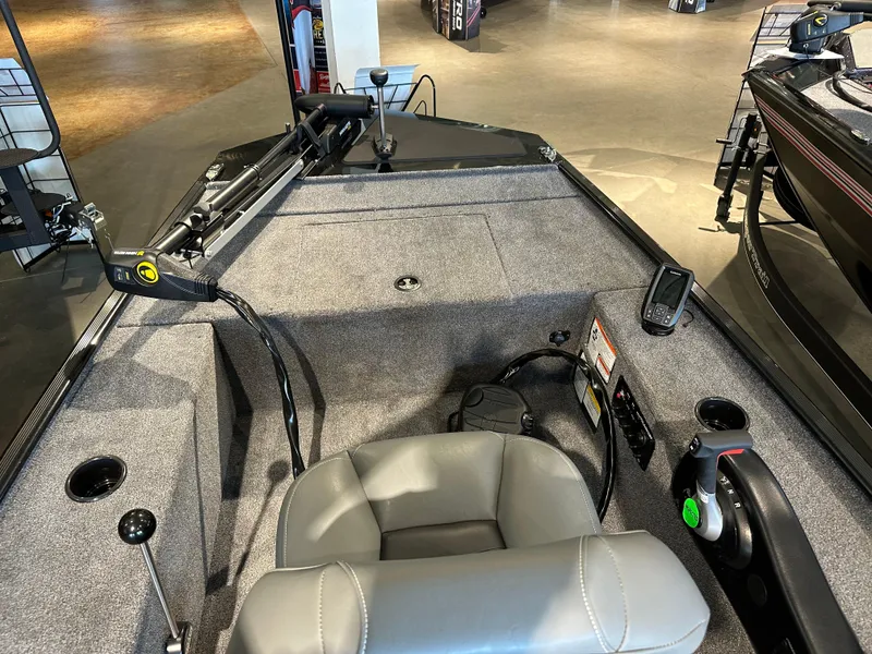 Slide: The Image of 2025 Tracker Panfish 17 boat interior with steering console and seating. - 3