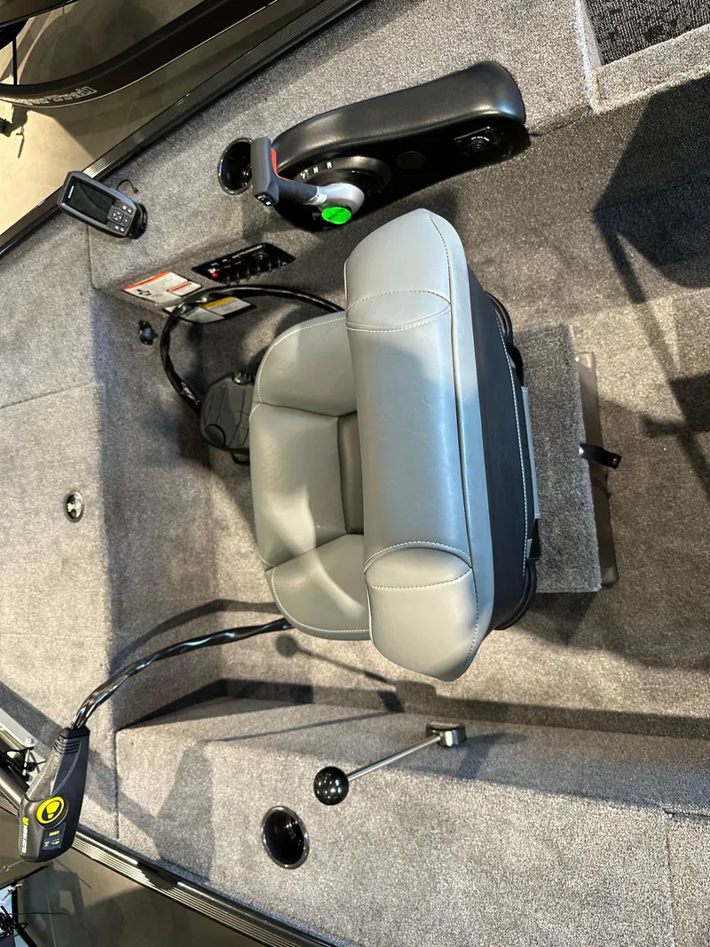 Slide: The Image of 2025 Tracker Panfish 17 boat interior with gray seating and control panel. - 4