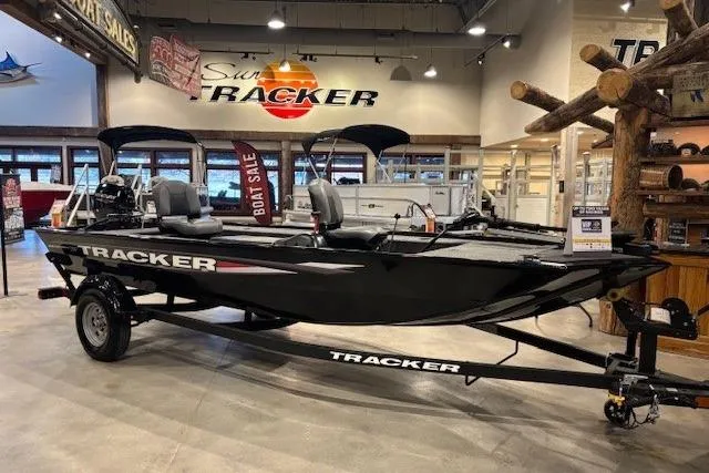 The Image of 2025 Tracker Panfish 17 boat displayed in showroom with sale signage. - 0