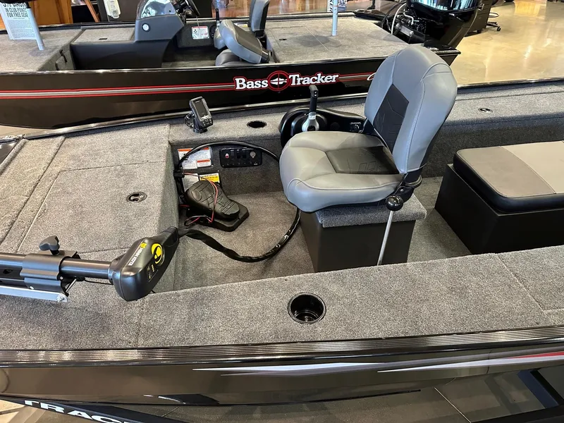 Slide: The Image of 2025 Tracker Panfish 17 boat interior with seating and control panel. - 2