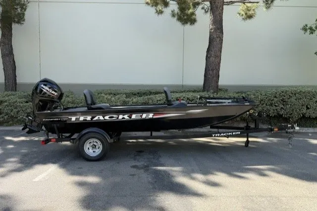 The Image of 2025 Tracker Panfish 17 boat on trailer, parked outdoors. - 0