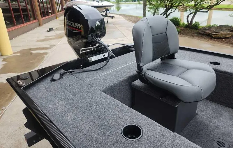 Slide: The Image of 2025 Tracker Panfish 17 boat with Mercury engine, featuring a comfortable gray seat. - 4