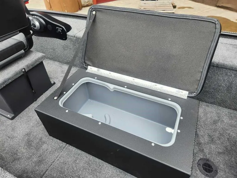 Slide: The Image of 2025 Tracker Panfish 17 boat with open storage compartment, gray interior. - 5