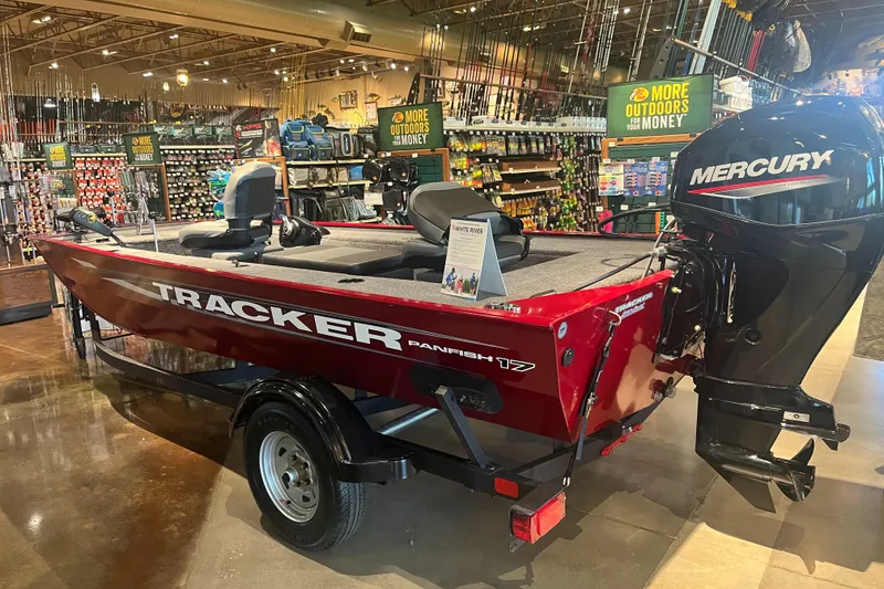 The Image of 2025 Tracker Panfish 17 boat with Mercury engine displayed in a store. - 0