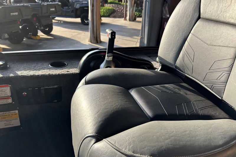 Slide: The Image of Interior of 2025 Tracker Panfish 17 boat with comfortable seating and control panel. - 10