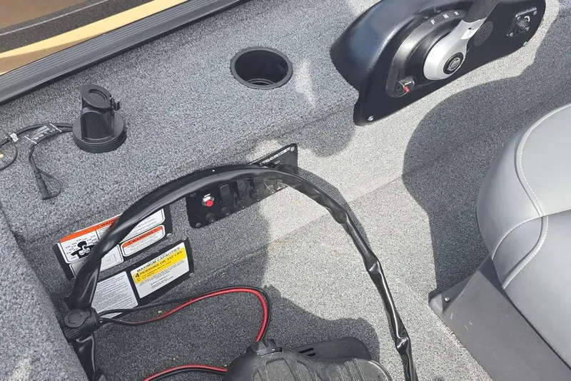 Slide: The Image of 2025 Tracker Panfish 17 boat interior with control panel and seating. - 3