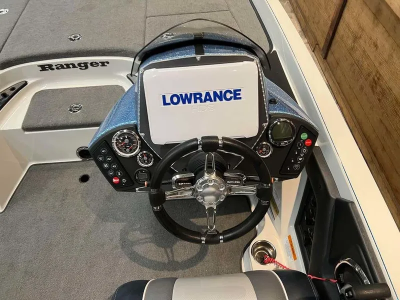 Slide: The Image of 2015 Ranger Z520C boat dashboard with Lowrance display and steering wheel. - 5
