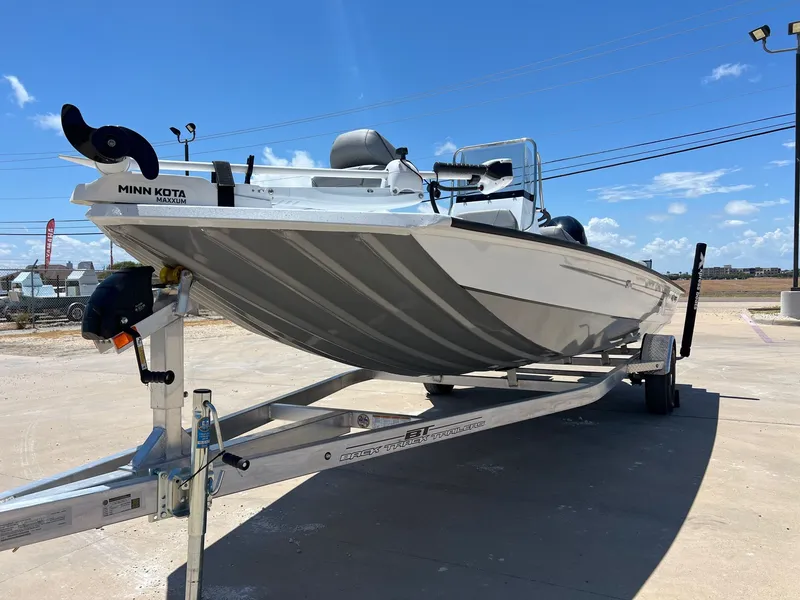 Slide: The Image of 2025 Xpress SW20B boat on trailer under clear blue sky. - 39
