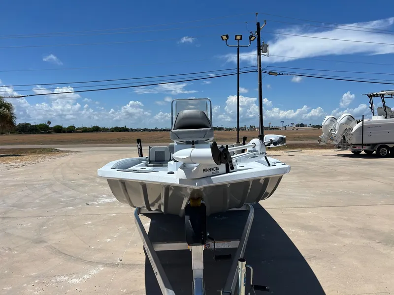 Slide: The Image of 2025 Xpress SW20B boat on trailer under clear blue sky. - 40
