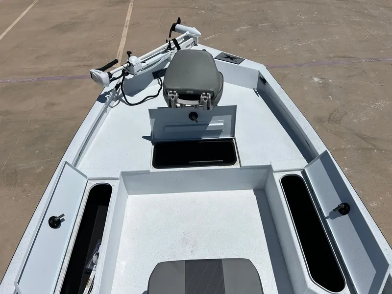 Slide: The Image of 2025 Xpress SW20B boat deck with storage compartments and seating. - 49