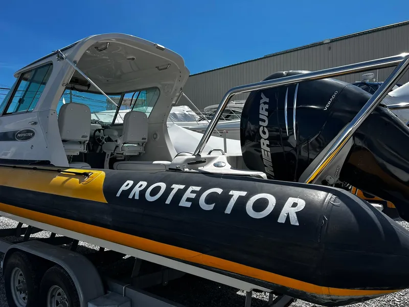 Slide: The Image of 2013 Protector Targa 30 boat with Mercury engine on trailer. - 10