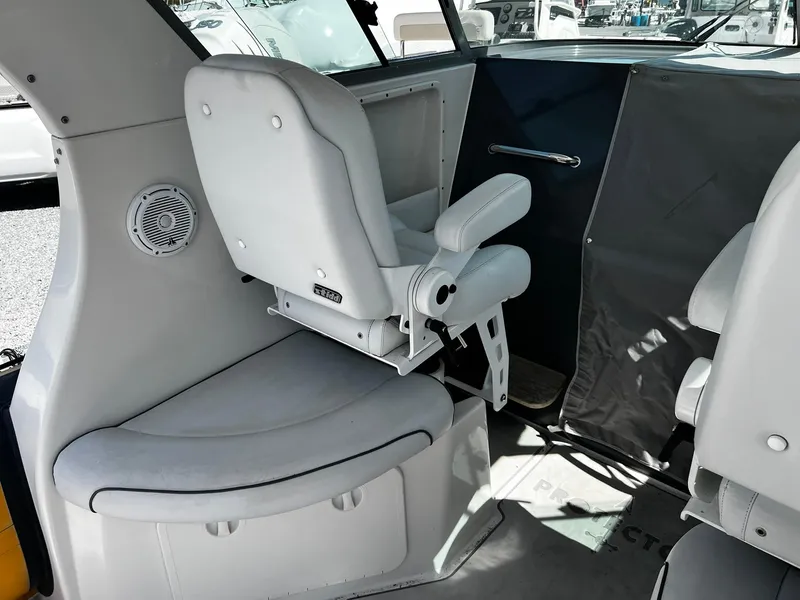 Slide: The Image of Interior of 2013 Protector Targa 30 boat with white seating and speaker. - 17