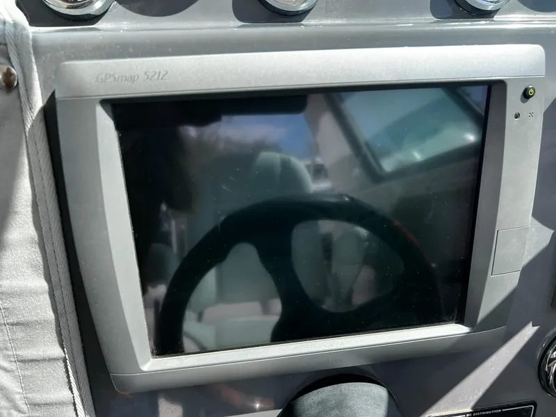 Slide: The Image of Dashboard of a 2013 Protector Targa 30 boat with GPSmap 5212 display. - 21