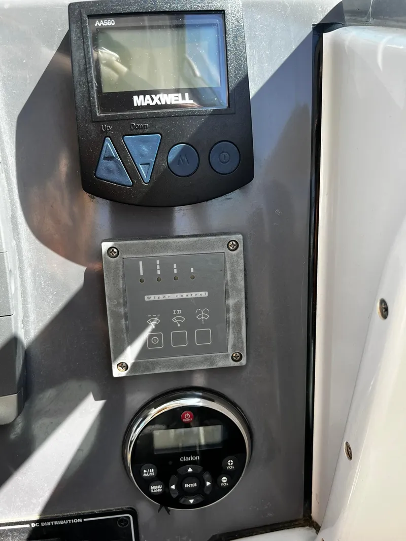 Slide: The Image of Control panel of a 2013 Protector Targa 30 boat with Maxwell display and buttons. - 23