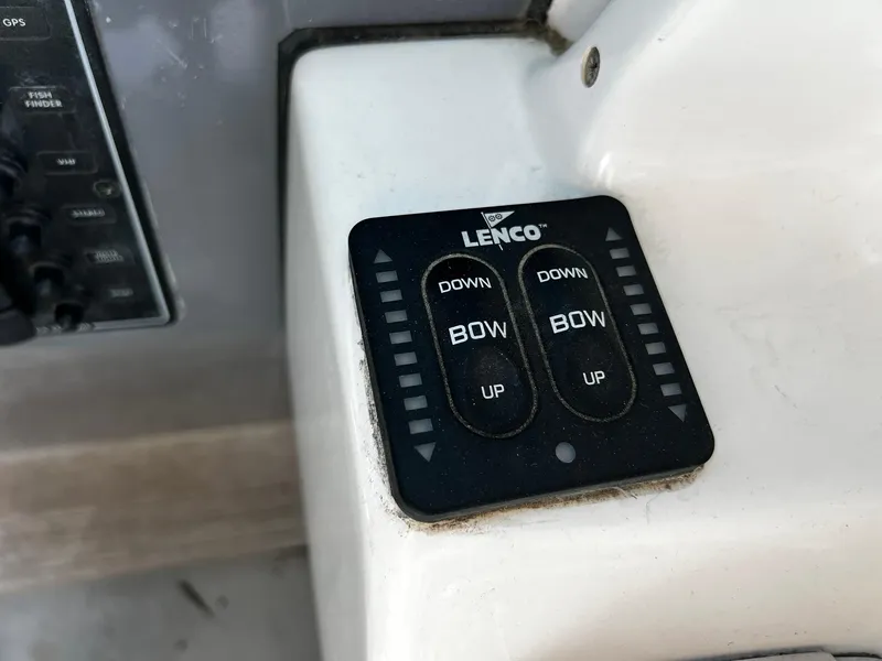 Slide: The Image of Lenco trim tab control panel on a 2013 Protector Targa 30 boat. - 26