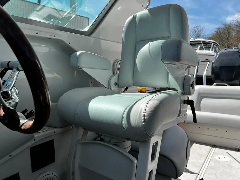 Slide: The Image of Captain's chair in 2013 Protector Targa 30 boat cockpit, featuring sleek design and comfort. - 31