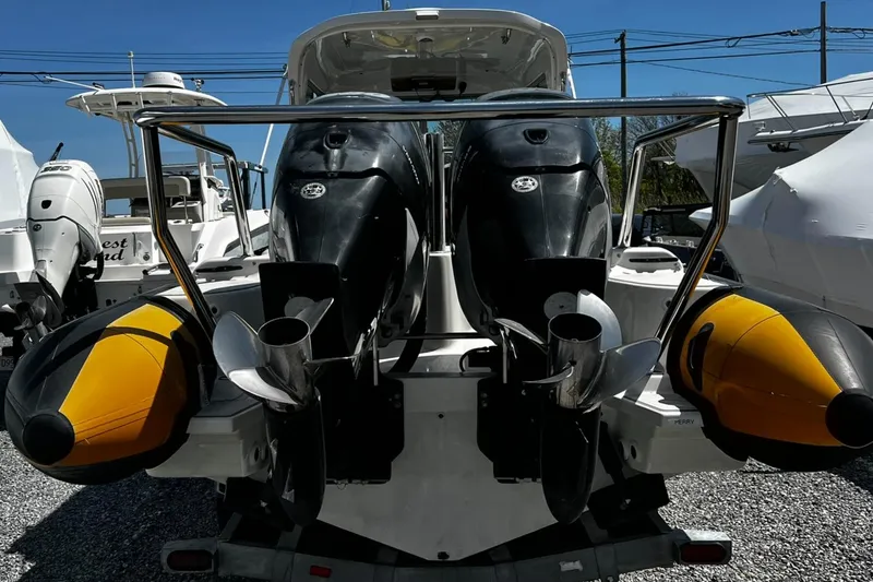 Slide: The Image of 2013 Protector Targa 30 boat with dual outboard motors and yellow inflatable tubes. - 6