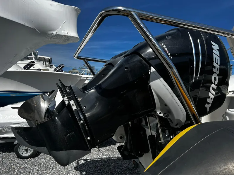 Slide: The Image of Outboard motor on a 2013 Protector Targa 30 boat, featuring a Mercury engine. - 8