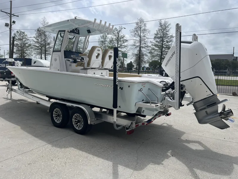 Slide: The Image of 2023 Sportsman Masters 267 boat on trailer, featuring Mercury outboard engine. - 11