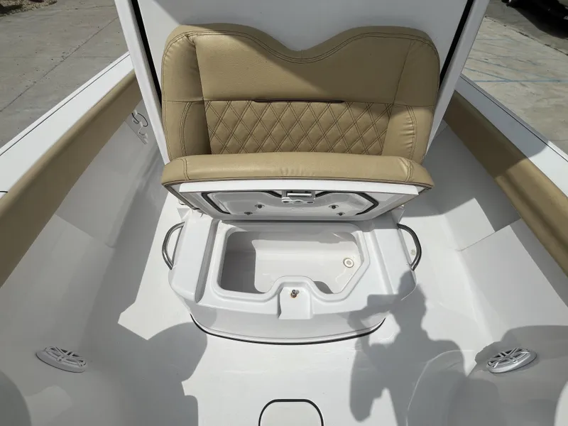 Slide: The Image of 2023 Sportsman Masters 267 boat seat with storage compartment, beige upholstery. - 18