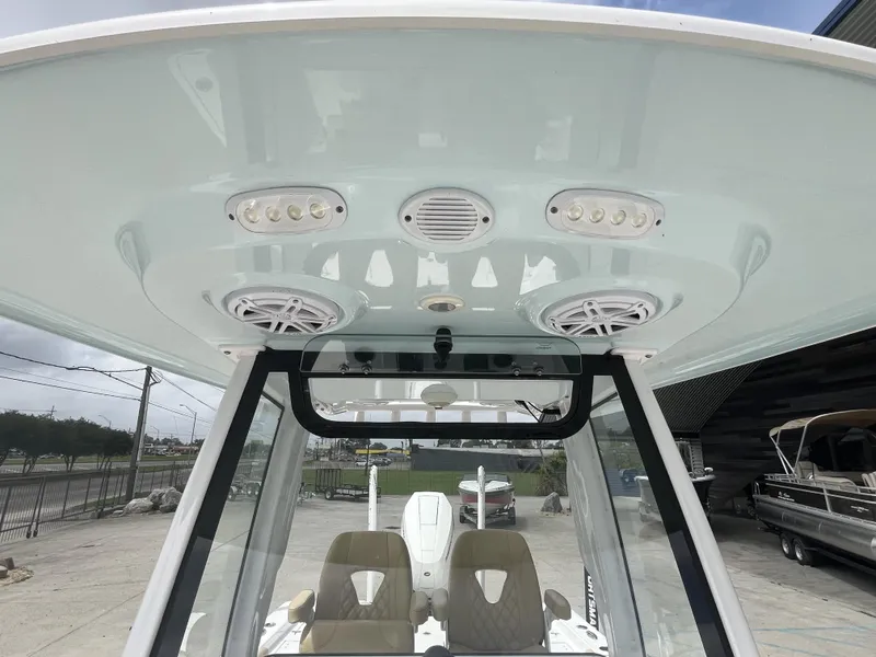 Slide: The Image of 2023 Sportsman Masters 267 boat interior with speakers and lights on the ceiling. - 19