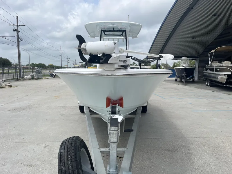 Slide: The Image of 2023 Sportsman Masters 267 boat on trailer, parked outdoors near a large building. - 3