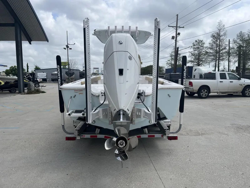 Slide: The Image of 2023 Sportsman Masters 267 boat on trailer, rear view, in outdoor dealership lot. - 4