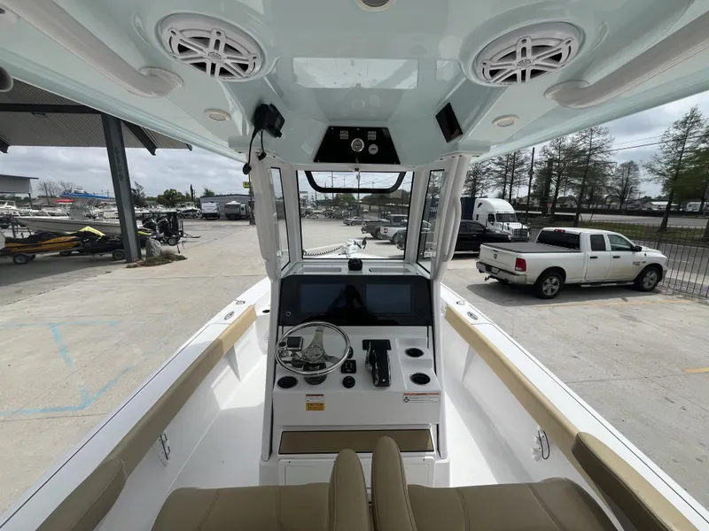 Slide: The Image of 2023 Sportsman Masters 267 boat interior with modern console and seating. - 7