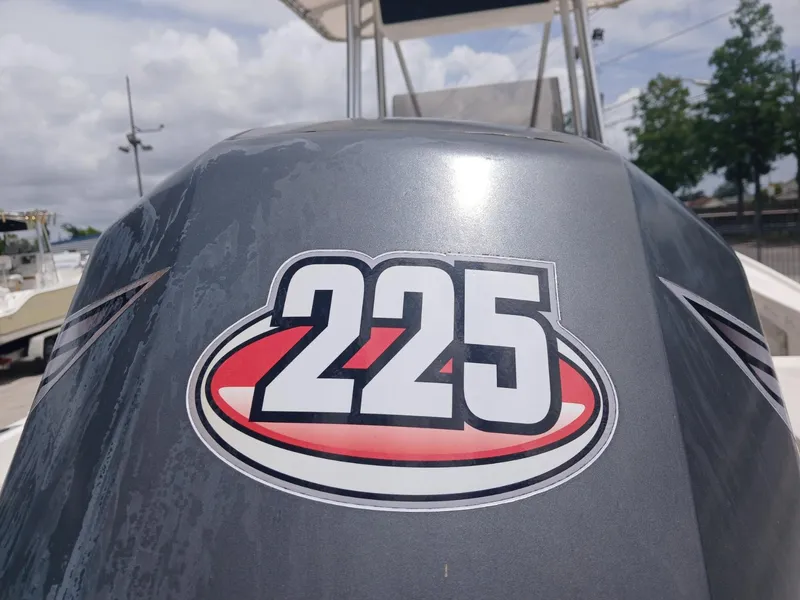 Slide: The Image of Outboard motor with "225" decal on a Mako 213 boat, 1980 model. - 3