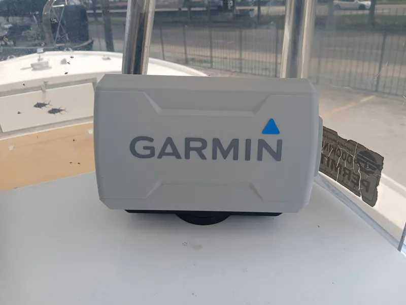 Slide: The Image of Garmin device on 1980 Mako 213 boat dashboard, close-up view. - 6