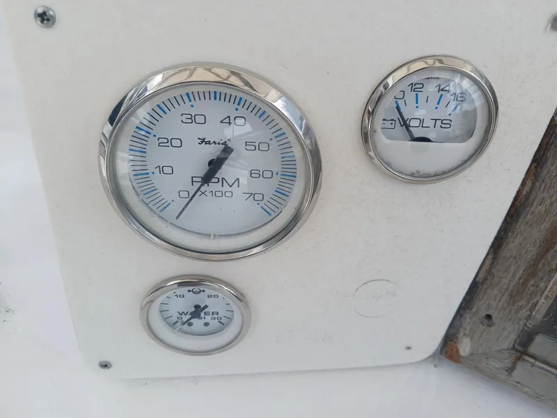 Slide: The Image of Vintage Mako 213 boat dashboard with RPM and volt gauges, 1980 model. - 7