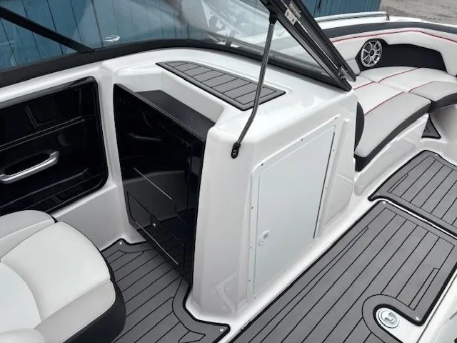 Slide: The Image of 2018 Yamaha Boats 212X interior with sleek seating and storage compartments. - 14