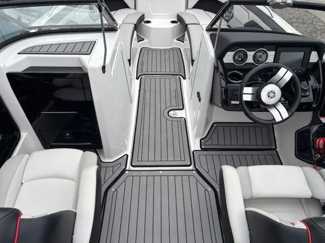 Slide: The Image of 2018 Yamaha Boats 212X interior with sleek design, modern dashboard, and comfortable seating. - 16