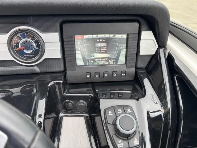 Slide: The Image of Dashboard of a 2018 Yamaha Boats 212X, featuring a digital display and control panel. - 22
