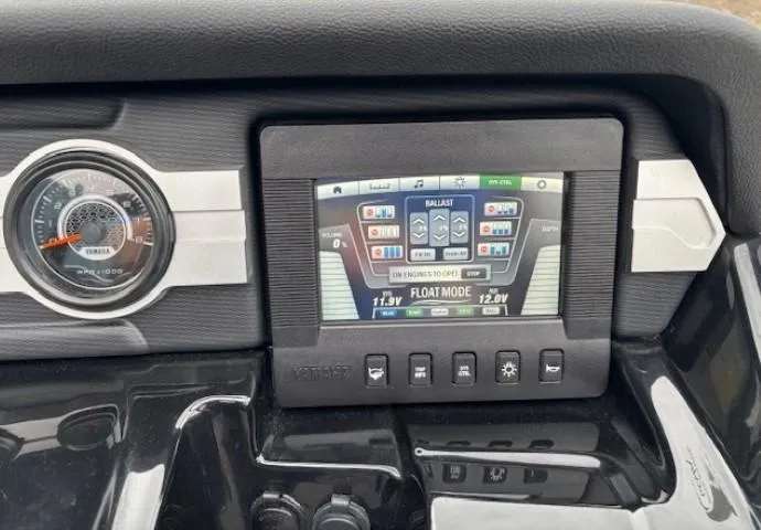Slide: The Image of 2018 Yamaha Boats 212X dashboard with digital display and control buttons. - 23