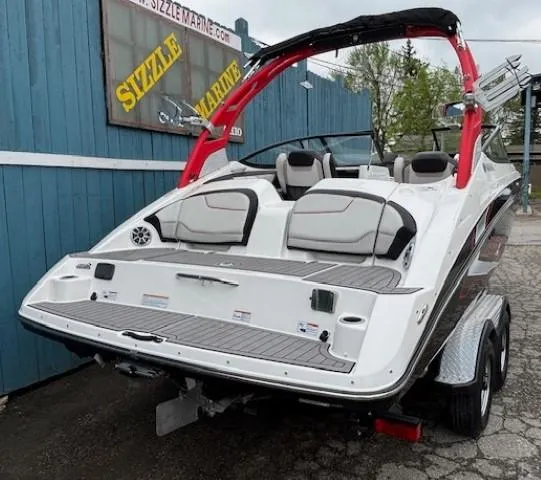 Slide: The Image of 2018 Yamaha Boats 212X on trailer, featuring sleek design and vibrant red accents. - 3
