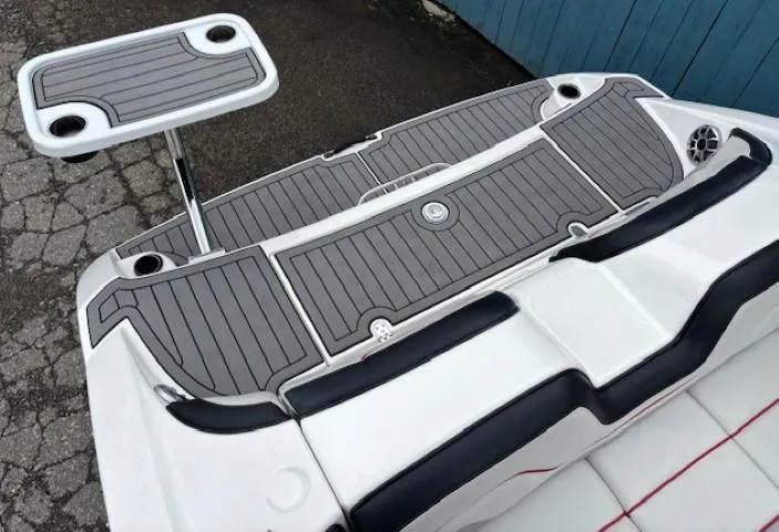 Slide: The Image of 2018 Yamaha Boats 212X swim platform with table and gray decking. - 34