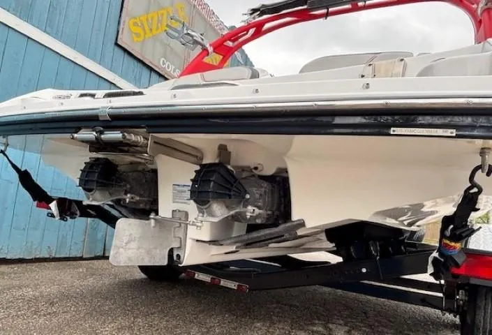 Slide: The Image of 2018 Yamaha Boats 212X, rear view, showcasing dual engines and sleek design. - 5