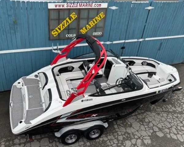 Slide: The Image of 2018 Yamaha Boats 212X with red accents, displayed at Sizzle Marine, Ohio. - 6