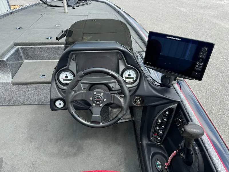 Slide: The Image of 2013 Blazer 625 boat dashboard with steering wheel and electronic display. - 14