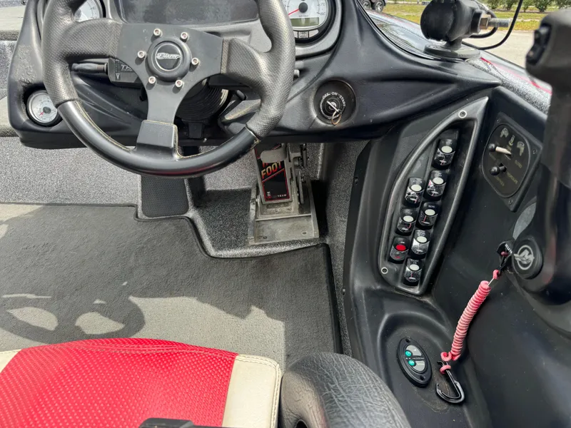 Slide: The Image of Interior of a 2013 Blazer 625 boat showing steering wheel and control panel. - 16