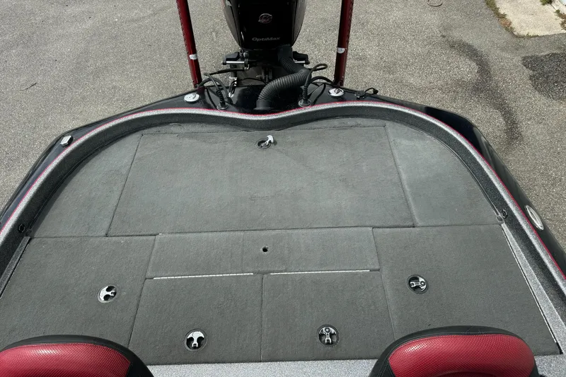 Slide: The Image of 2013 Blazer 625 boat deck with motor, featuring red accents and storage compartments. - 17