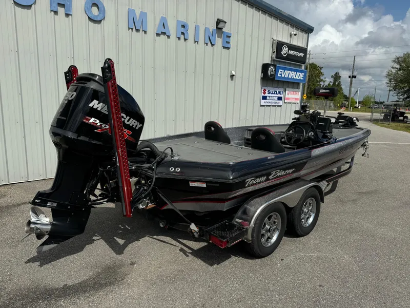 Slide: The Image of 2013 Blazer 625 boat with Mercury engine at a marine dealership. - 21