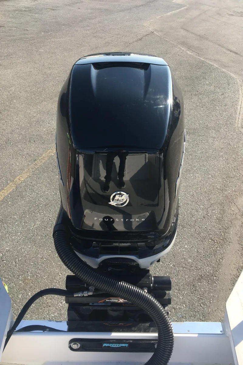 Slide: The Image of Outboard motor on a 2019 Axopar 28 CABIN boat, viewed from above. - 13
